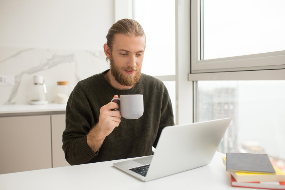 man drinking coffee in the office