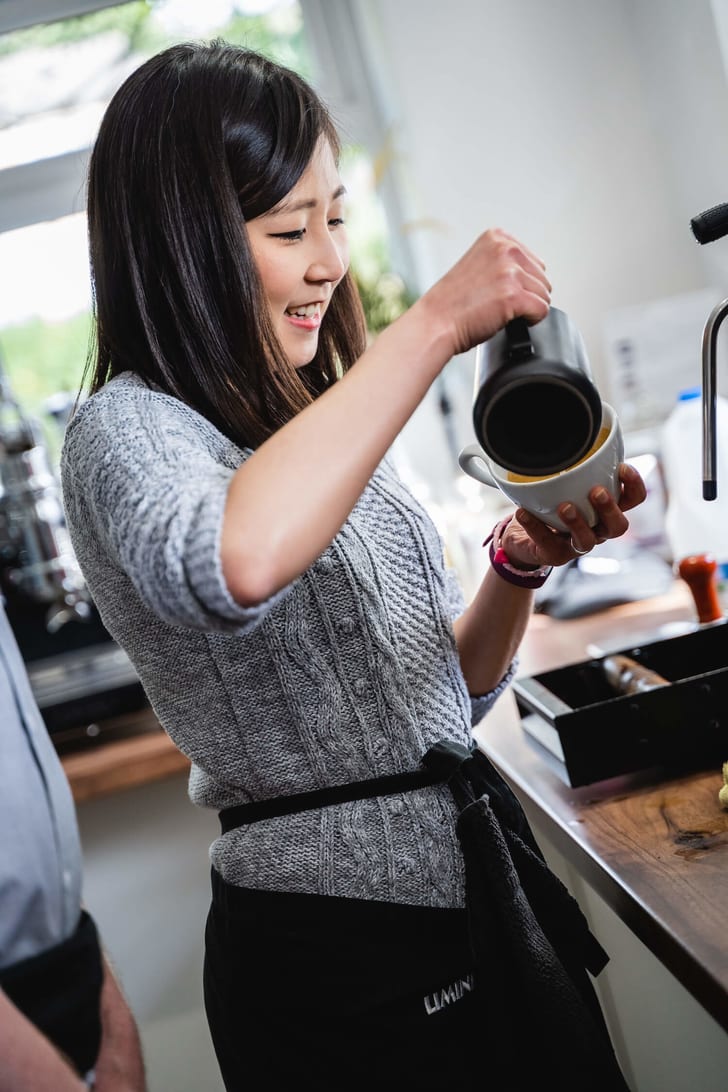 Customer pouring coffee