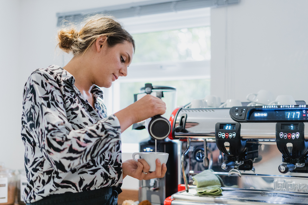 Barista pouring coffee